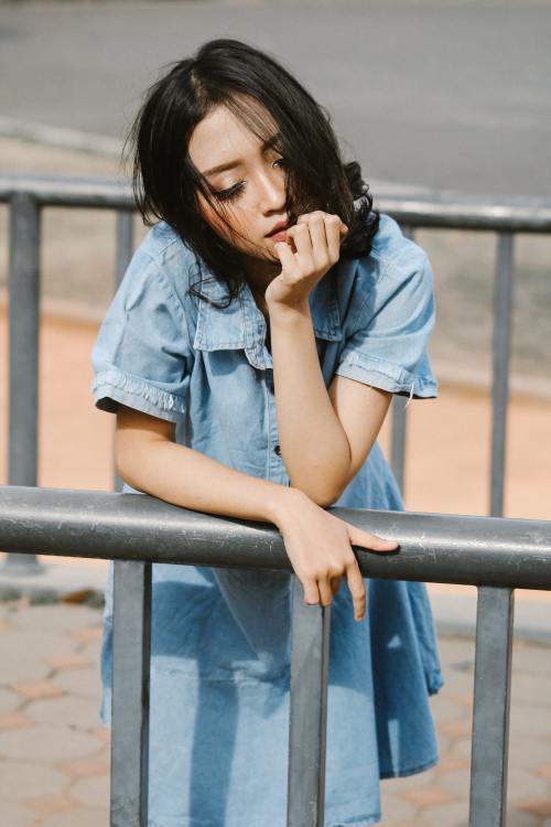 Woman Touching Her Straight Black Hair