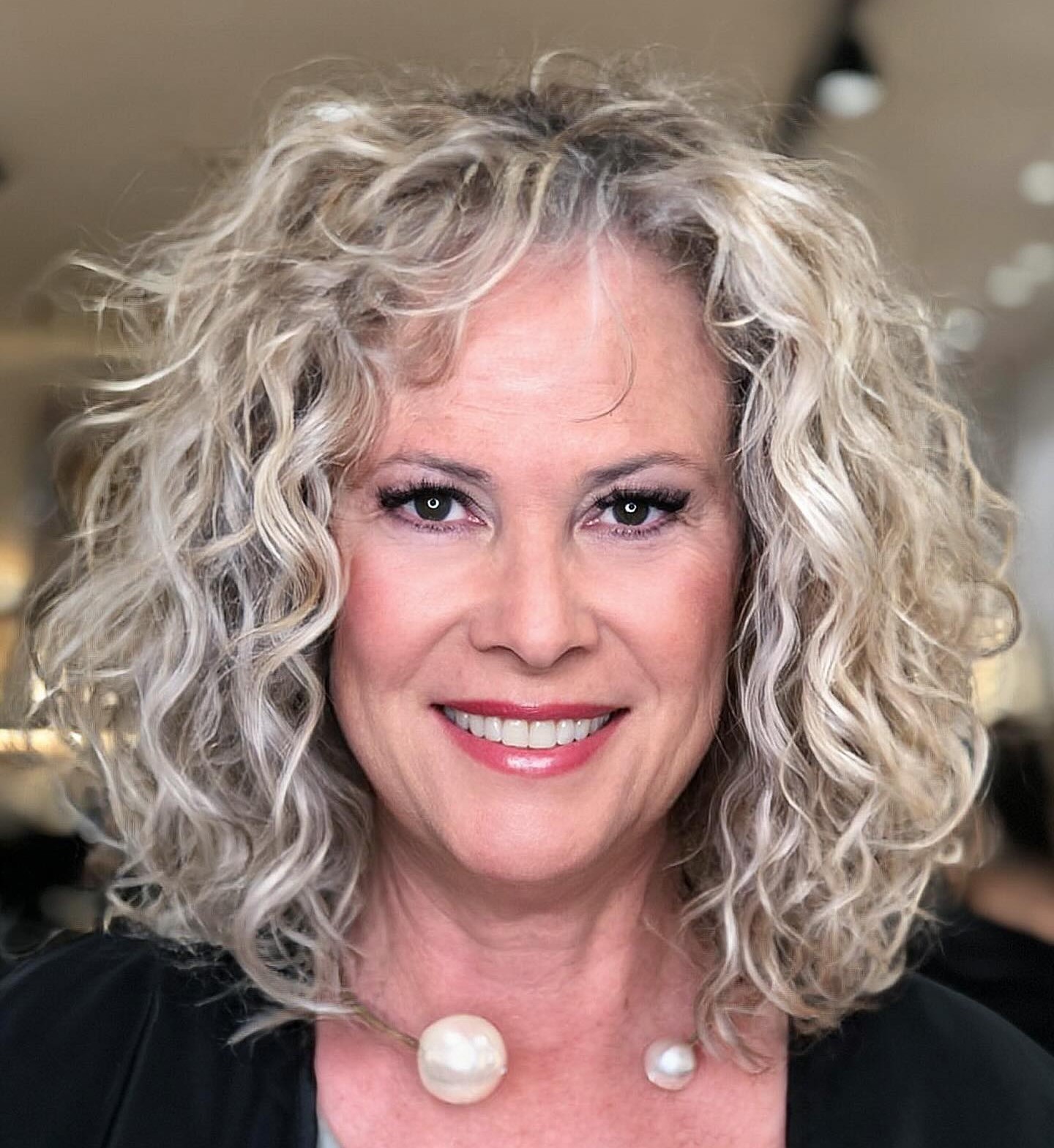 Over Blonde Layered Curly Lob