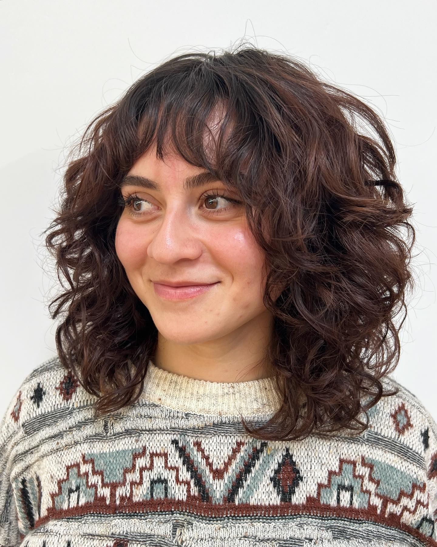 Curly Hair Mid Length Curly Shag with Arched Bangs