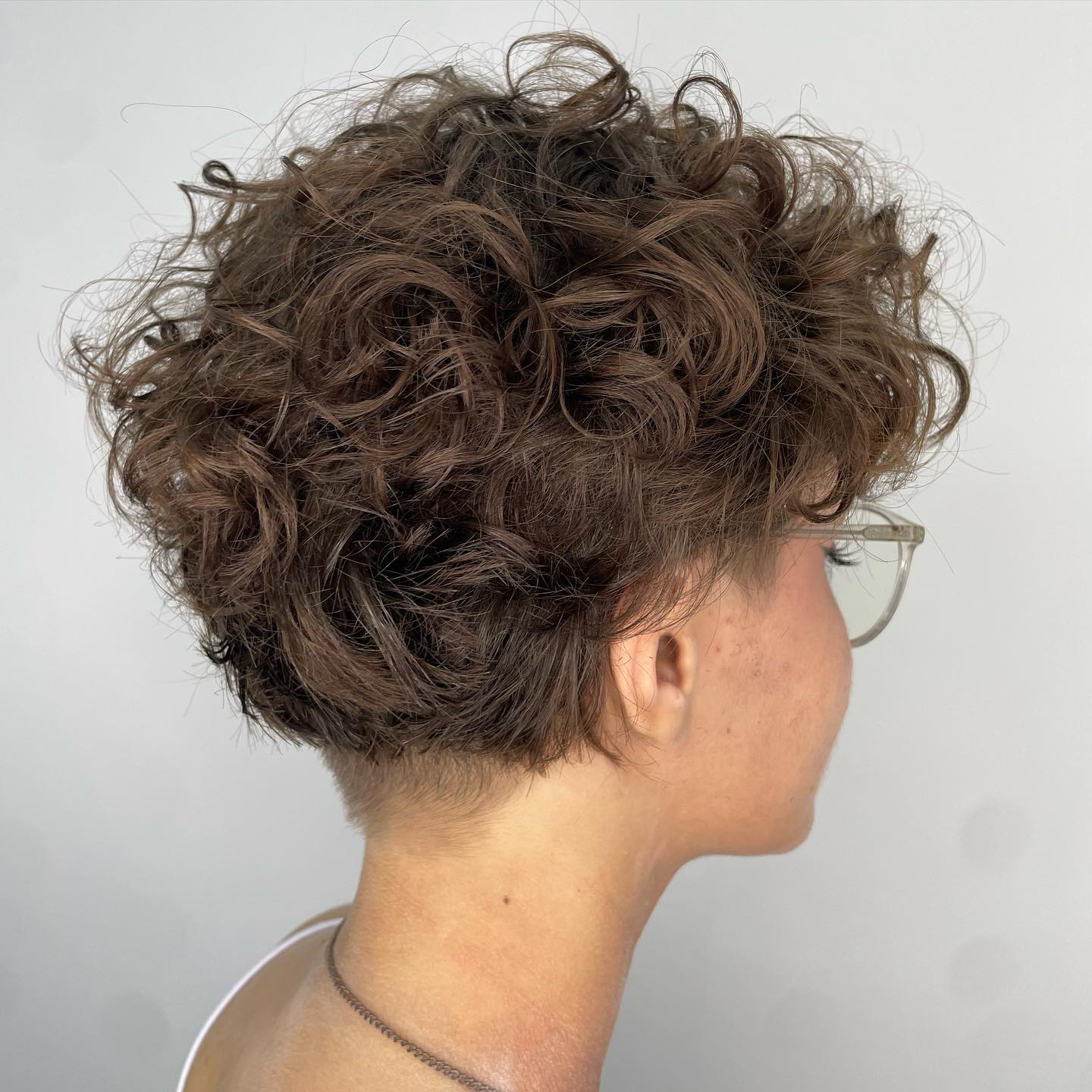 Curly Pixie Haircut with Nape Undercut