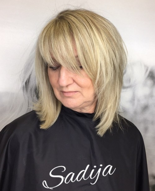 Medium Layered Haircut With Bangs