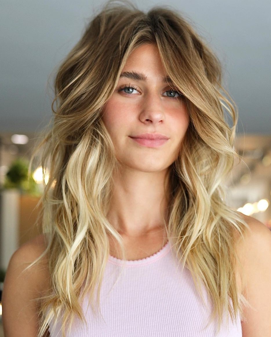 Layers and Curtain Bangs on Long Blonde Wavy Hair
