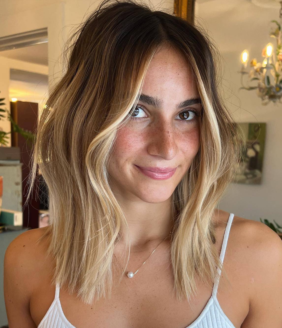 Bottleneck Bob Medium Length Haircut with Curtain Bangs and Face Framing Highlights