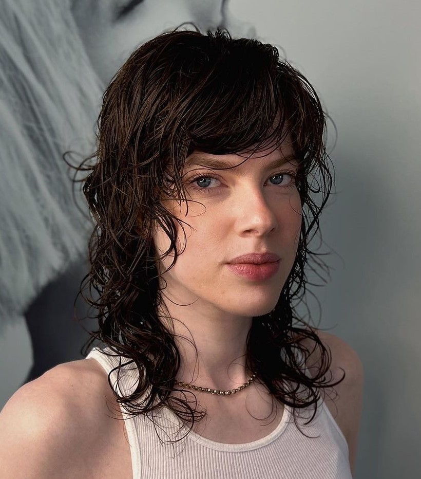 Medium Hairstyle with Full Side Bangs and Choppy Layers