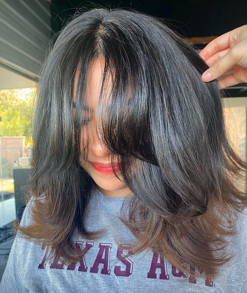 Mid length Cut with Textured Layers and Bangs