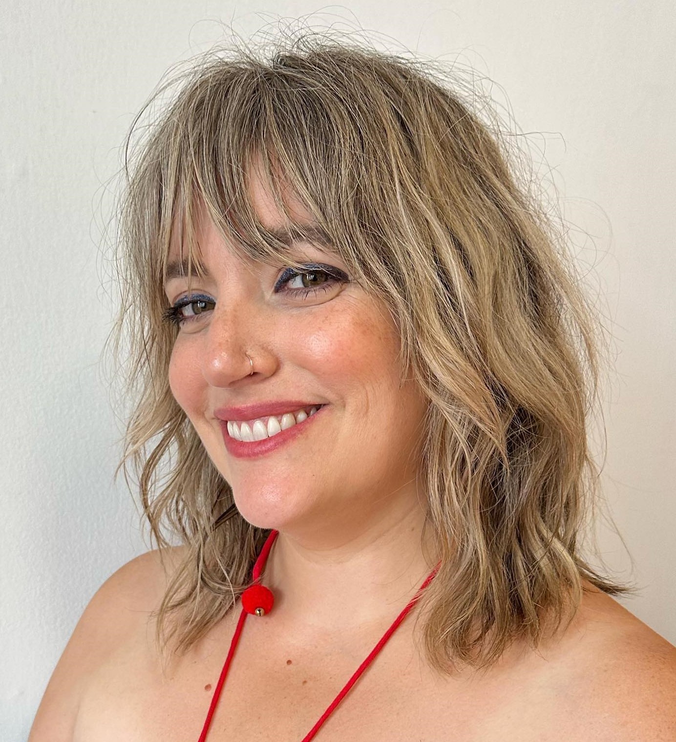 Shaggy Lob Medium Length Hairstyle with wispy Bangs