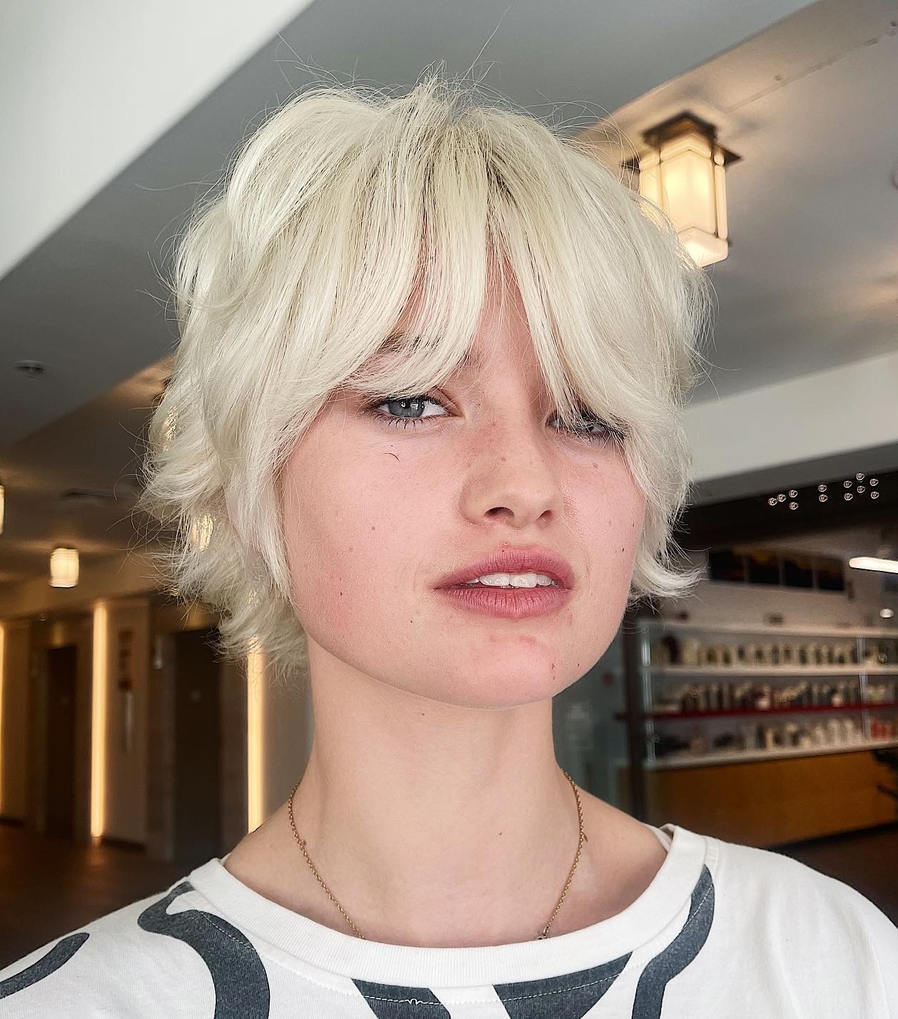 Layered Pixie Bob with Curtain Bangs for Square Faces