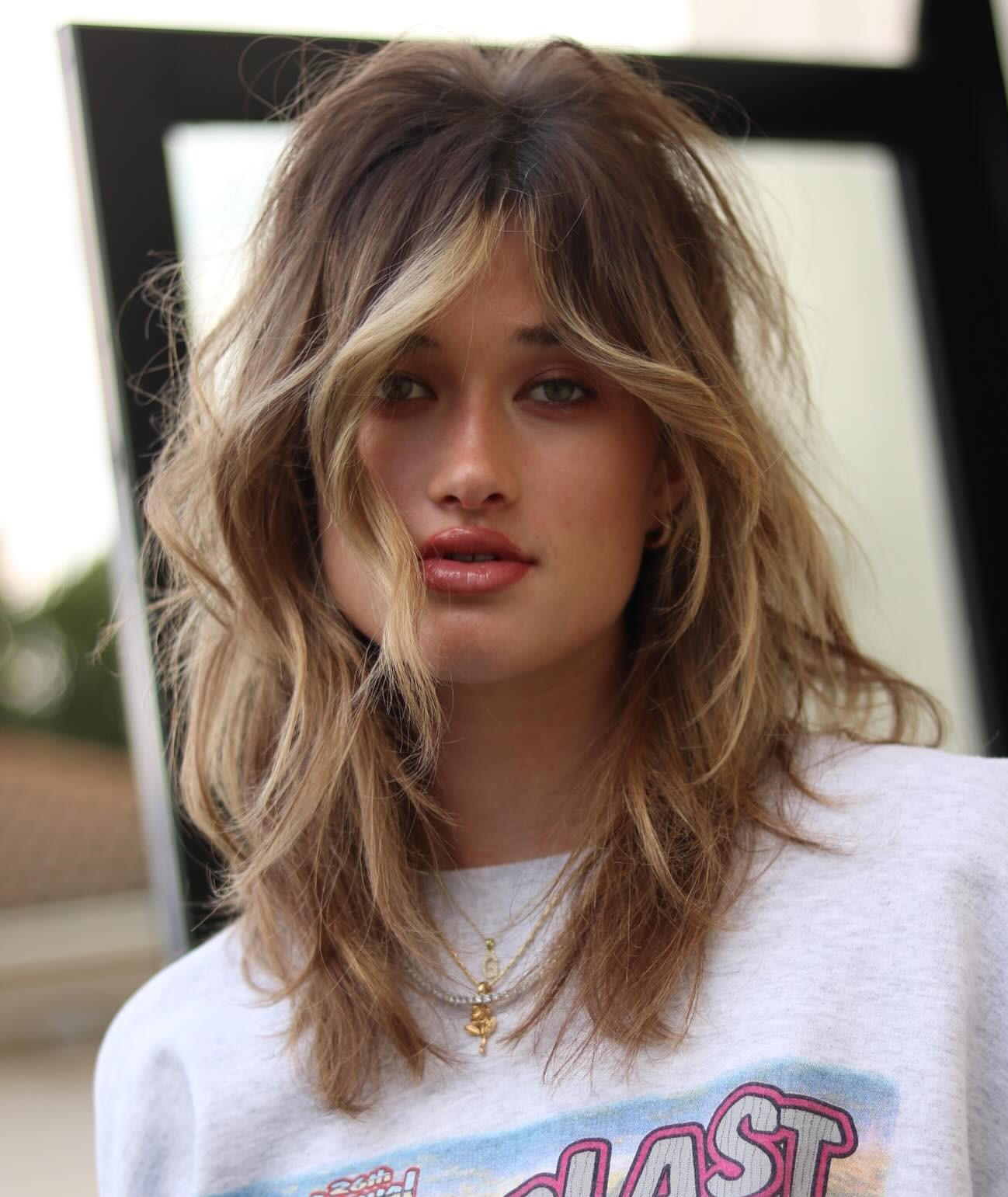 Textured Layers Tousled Medium Hairstyle with Face Framing Layers